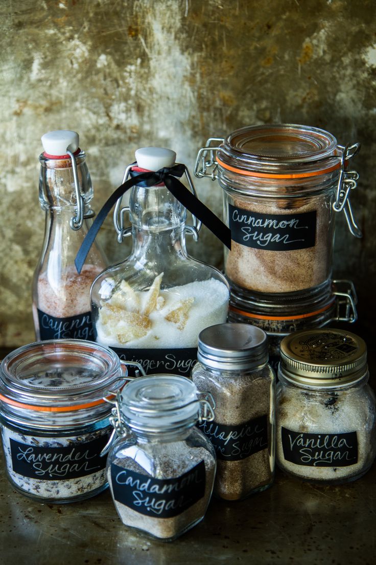 several jars filled with different types of spices