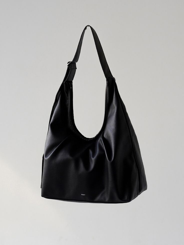 Editor's NotesEasy and practical bag designed by Ecrit will add an accent on your outfit- Sizable bag that can carry everything- Made from soft vegan leather- Top zipper fastening- Accented with wrinkle detail- Adjustable strapMeasurements(in.)- W x H x D: 17.3 in. x 16.1 in. x 5.1 in.- Strap height 11.8 in. - 22.0 in.- Weight 300gComposition & Care- Outshell: Vegan leather (Polyurethane)- Lining: Polyester- Do not washDesigner- by Ecrit Chic Shoulder Bag With Zipper Closure For Everyday Use, Versatile Everyday Shoulder Bag With Zipper, Versatile Soft Leather Baguette Bag For Errands, Versatile Everyday Soft Leather Shoulder Bag, Versatile Daily Soft Leather Shoulder Bag, Chic Daily Hobo Bag With Large Capacity, Chic Everyday Large Capacity Hobo Bag, Practical Bag, Wardrobe Outfits