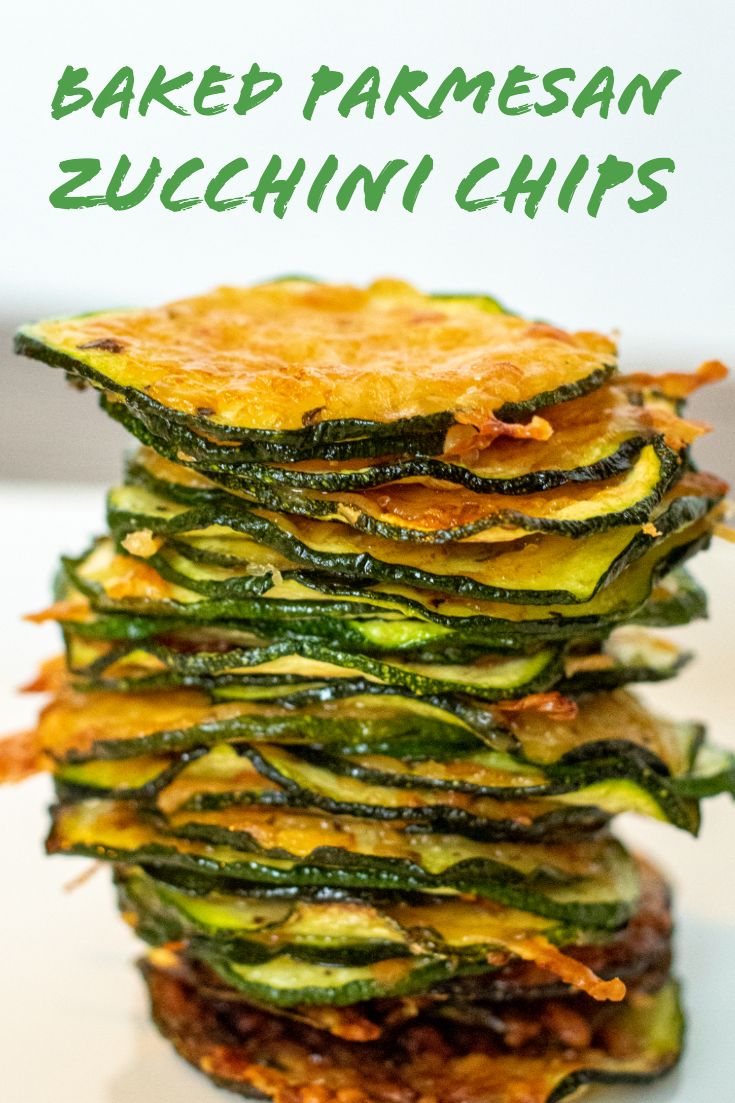 a stack of baked parmesan zucchini chips stacked on top of each other