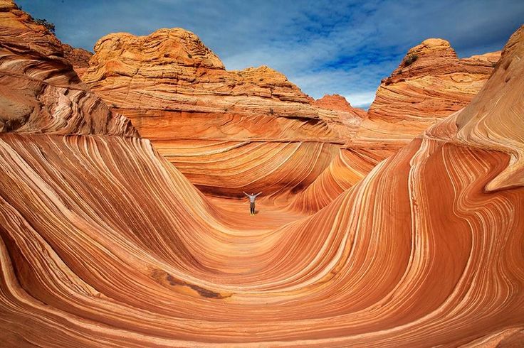 a person standing in the middle of an area that looks like it is made out of rock