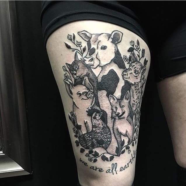 a woman's leg with an animal tattoo on it and the words, we are all animals