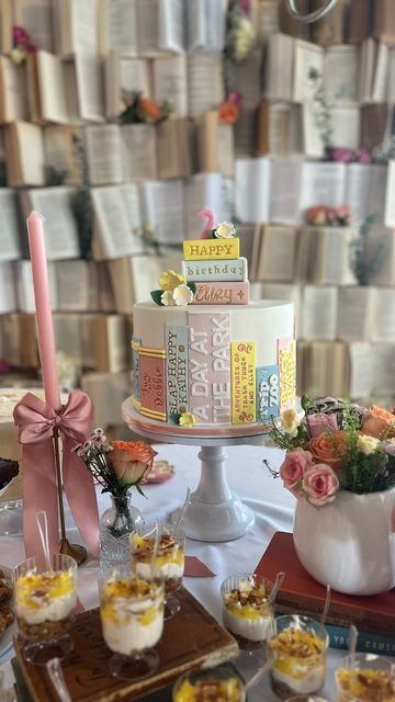 a table topped with lots of cakes and desserts