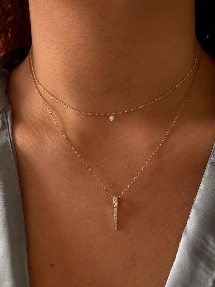 Simplicity is key whether you're after the perfect everyday touch of sparkle, or looking to add a new piece within your layered necklace story. A 0.12ct SI clarity, G-H color Diamond is free floating to show the stone in its best form. Adjustable length. 15-17'' length. Elegant Double Strand Diamond Necklaces, Classic Diamond Clavicle Chain Necklace For Party, Elegant Double Strand Diamond Necklace, Classic Diamond Clavicle Necklace For Parties, Classic Party Diamond Necklace With Clavicle Chain, Classic Yellow Gold Necklace With Jewels, Modern Double Strand Jewelry For Formal Occasions, Timeless Long Drop Necklaces For Formal Occasions, Formal Long Drop Necklaces In Fine Jewelry Style