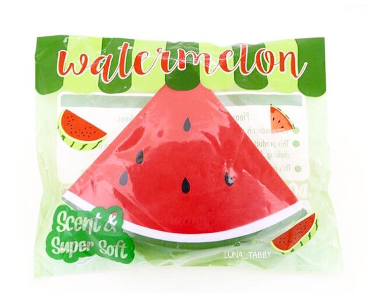 a plastic watermelon shaped object on top of a packaged package with the word'watermelon'printed on it