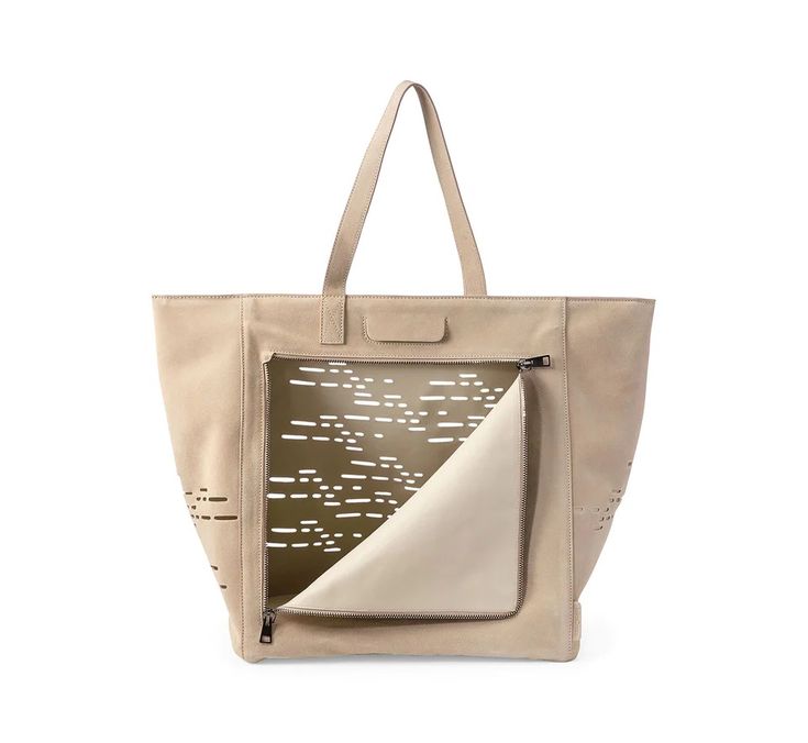 a white bag with an abstract design on the front and side, it has a pocket for