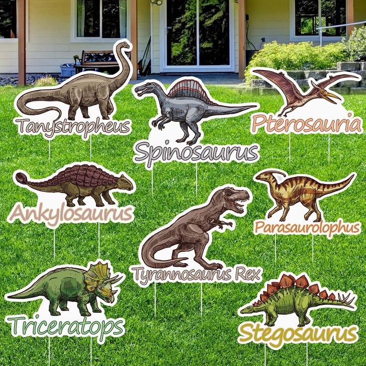 dinosaur party yard stakers with names and pictures on them in front of a house