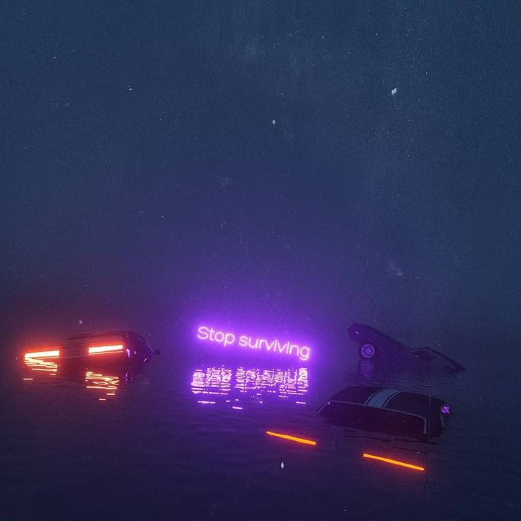 there are two boats in the water with neon lights