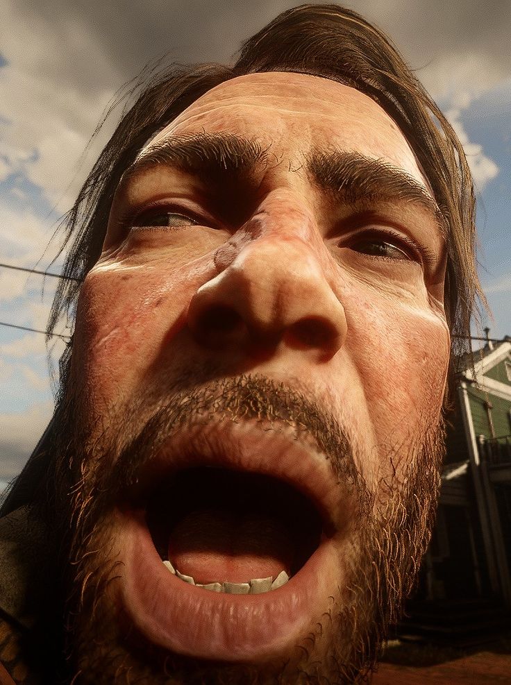 a close up of a person with his mouth open