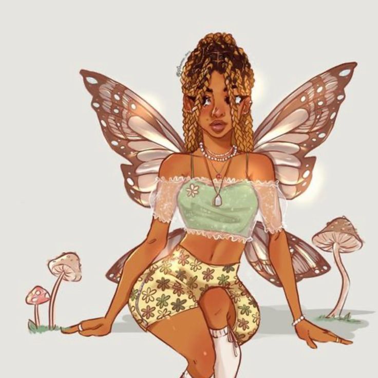 a woman dressed as a fairy sitting on the ground with mushrooms in front of her