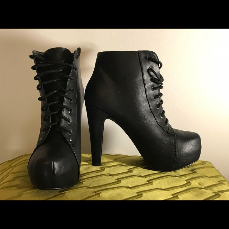 Black Ankle Boot That Ties In Front. The Strings Are Black And It Has About A 5 Inch Heel Casual High Ankle Lace-up Boots For Party, Casual Lace-up Platform Boots For Party, Ankle-high Lace-up Boots For Night Out In Fall, Casual Lace-up Boots For Parties, Fitted Black High-top Lace-up Boots, Black Fitted Lace-up Boots For Casual Wear, Casual Ankle Lace-up Boots For Party, Edgy Ankle-high Lace-up Boots For Night Out, Lace-up Platform Boots For Night Out In Fall