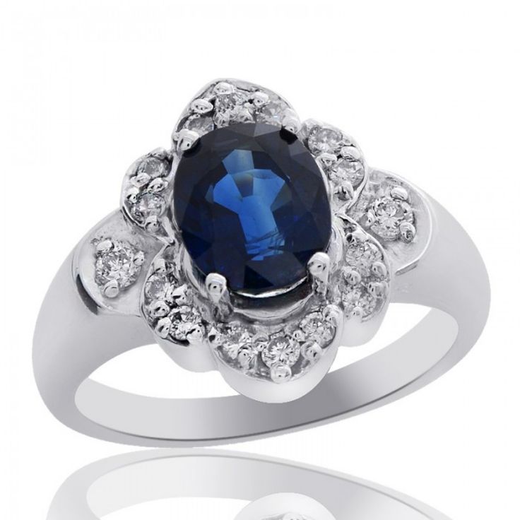 Simply Stunning, This Cocktail Ring Showcases An Elegant Oval-Shape Blue Sapphire Gemstone In A Prong Setting Weighing 1.65 Carat (Total Carat Weight). To Enhance This Beautiful Blue Sapphire, Surrounding The Gemstone In A Unique Design Are Diamonds Weighing 0.25 Carat (Total Carat Weight) (G Si-1) In A Micro Pave Setting. Set In 14k White Gold, Ring Weighs 6.40 Grams And Is Size 7.00. Free Re Sizing. Wcr319 Formal Sapphire Birthstone Ring With Accent Stones, Classic Blue Cubic Zirconia Birthstone Ring, Classic Blue Sterling Silver Halo Ring, Oval Blue Diamond Ring With Polished Finish, Blue Oval Diamond Ring With Polished Finish, Formal Blue Diamond Birthstone Ring, Classic Blue Halo Ring, Formal Blue Halo Ring With Diamond Accents, Formal Blue Cubic Zirconia Birthstone Ring