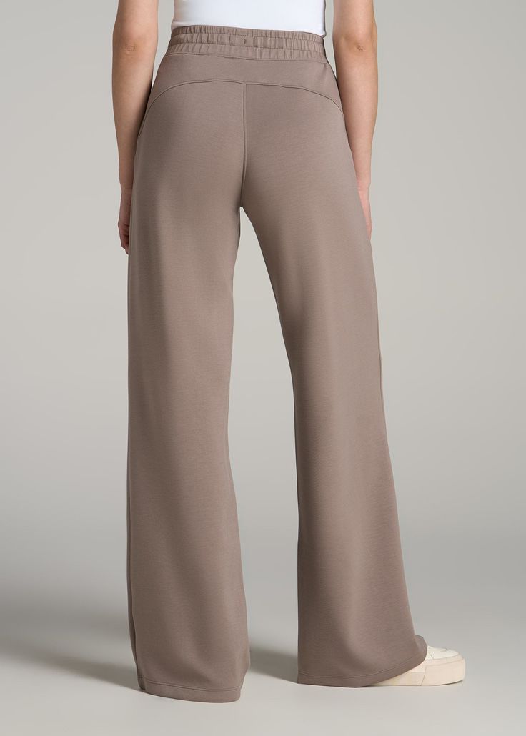 Versatile Wide Leg Tall Women's Pants Stay Comfy While Going Casual Our Pull-On Tie Waist Wide Leg Pants for Tall Women offer a blend of comfort and fashion. Whether strolling the neighborhood or staying fit, these tall pants for women are perfect for both athletic activities and casual outings, making them a versatile addition to any wardrobe.• Wide leg and oversized fit for a modern look• Drawstring and elastic waist for a comfortable fit• Full length with side seam pockets SIZE & FIT: Tall In Pants For Tall Women, Scrubs Dress, Staying Fit, Tall Pants, Fall Denim, Flannel Women, Comfy Pants, Chino Jeans, Sleeveless Bodysuit