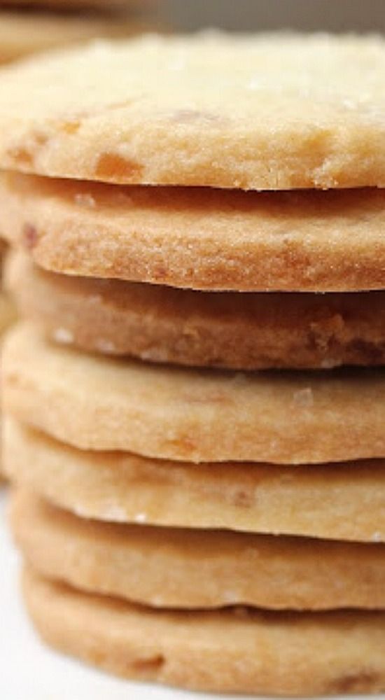 a stack of cookies sitting on top of a white countertop next to each other