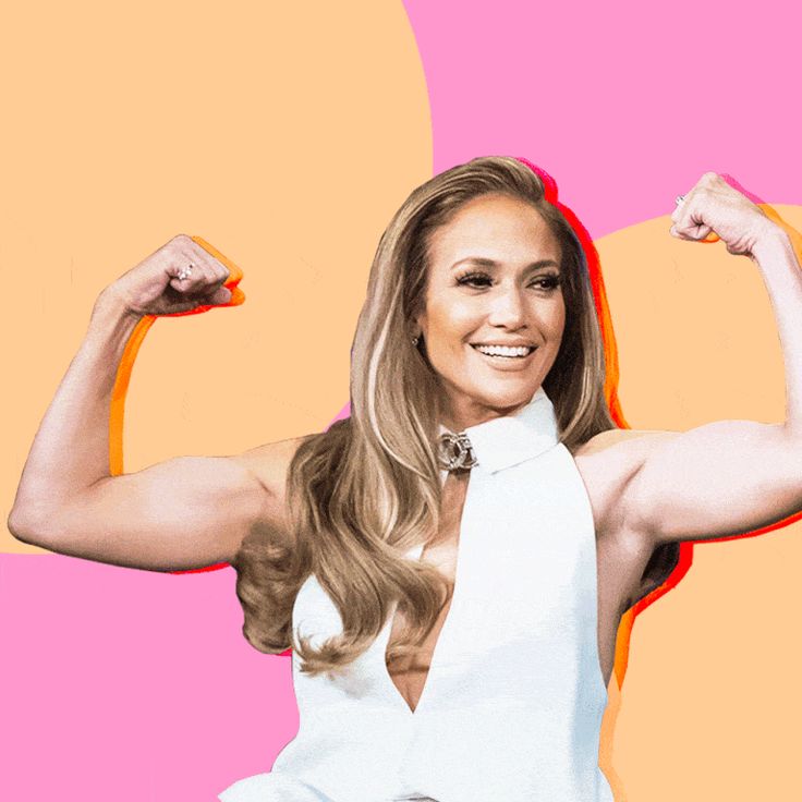 the woman is posing with her arms up and showing off her muscular muscles in front of a pink background