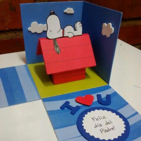 a pop up card with a snoopy dog on the roof