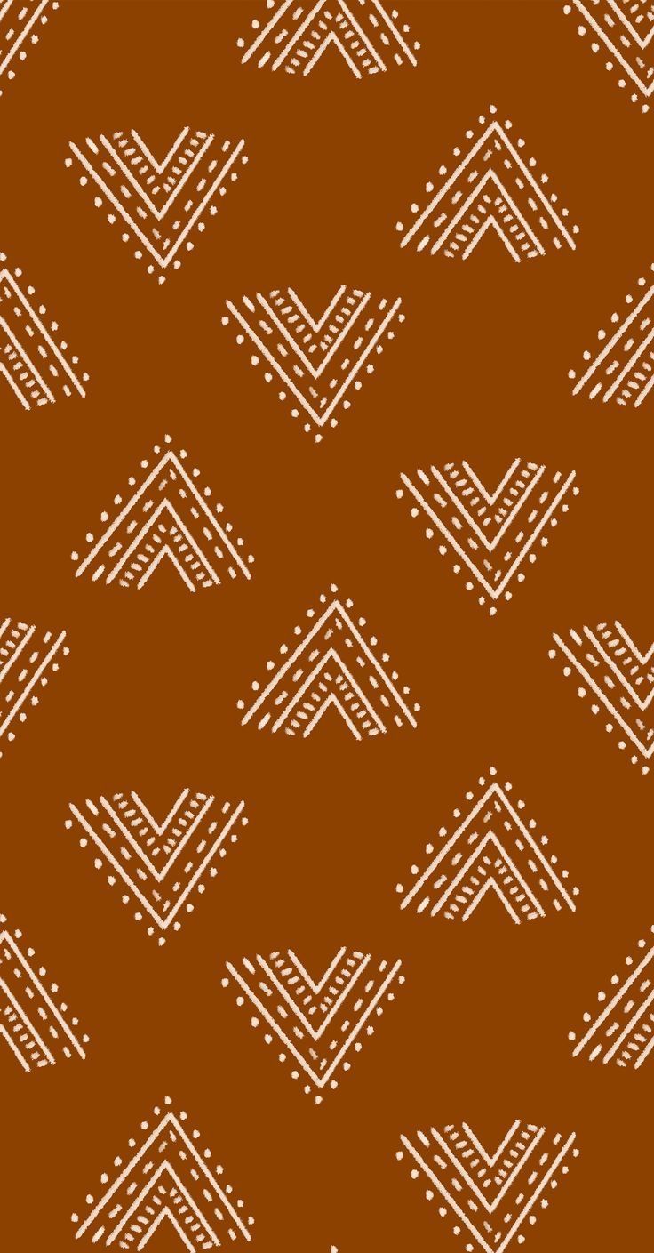 a brown background with white lines and dots on it, in the shape of an arrow