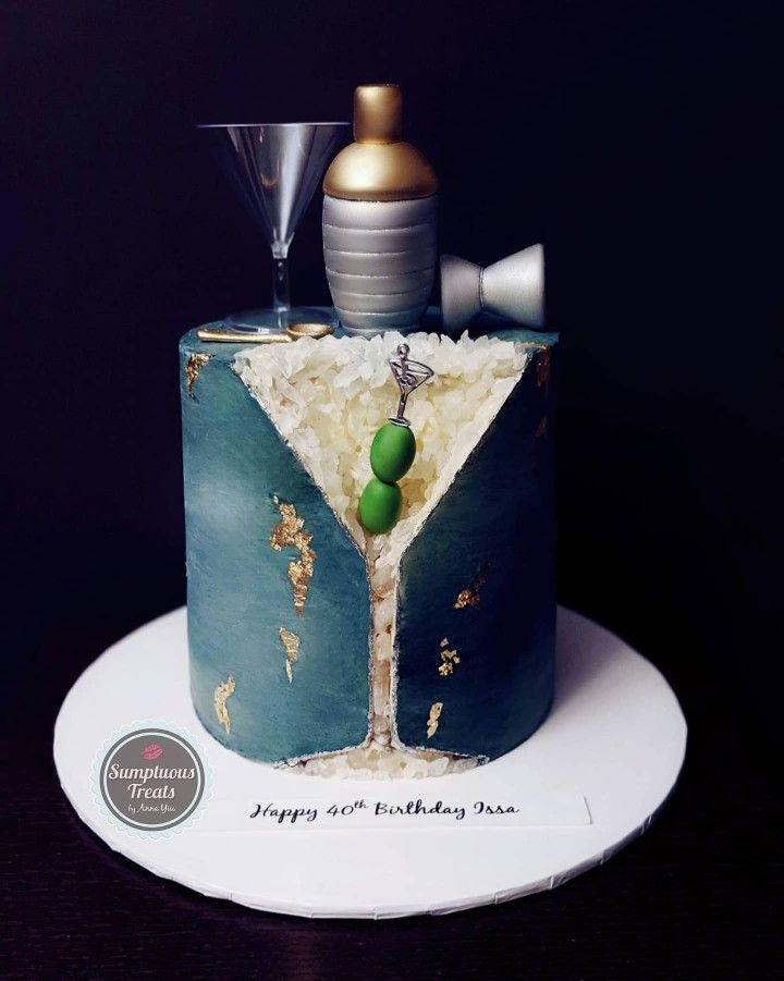 a birthday cake with a martini glass on top