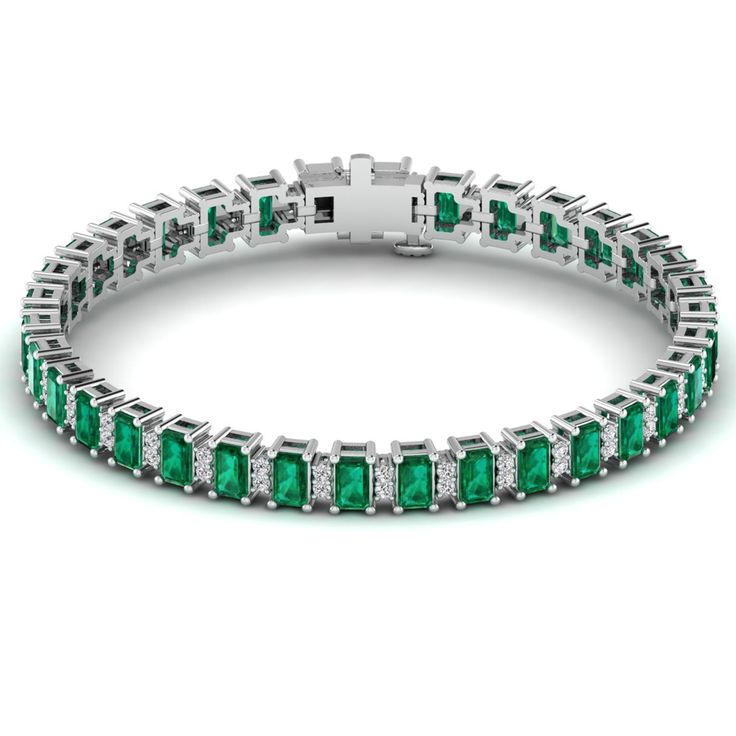 This exquisite emerald and diamond tennis bracelet is a stunning piece of jewelry that exudes elegance and sophistication. Crafted with precision and attention to detail, this bracelet features vibrant emeralds alternating with sparkling diamonds, creating a luxurious and timeless look that is perfect for any occasion. Metal: 14K Gold Setting Type: Prong Rhodium Finish: Yes, on White Gold Gemstone Details: Gemstone: Emerald Shape: Emerald Cut Average Dimensions: 5.00 x 3.00 MM Quantity: 34 Avera Emerald Bracelets, Diamond Bracelet Design, Dance Jewelry, Emerald Bracelet, Diamond Tennis Bracelet, Bracelet Design, Birthstone Gifts, Ring Pendant Necklace, Tennis Bracelet Diamond