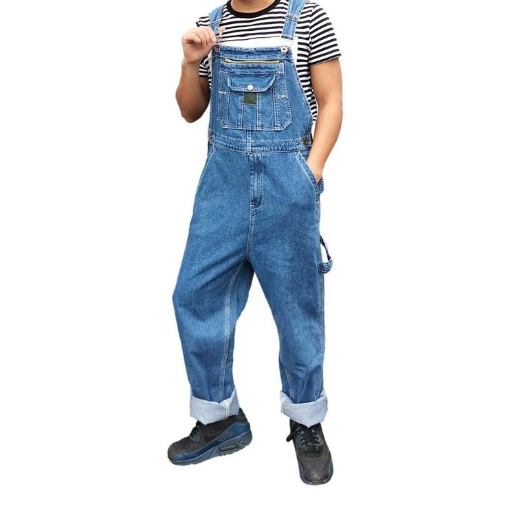 Bring back the 90s with our unrubbed men's denim dungaree from the 2023 Spring-Summer Collection ââ‚?an iconic piece that'll make you stand out in every crowd!Why You'll Love ItThis dungaree is designed to keep you stylish. comfortable. and on-style. Its medium wash and loose fit provide a timeless look and fit type that you can rock day or night. Plus. the suspenders & buttons closure. intricately painted prints. and sanded finish all come together to make this an unforgettable piece.Unmissable Blue Straight Leg Overalls For Streetwear, 90s Style Blue Denim Overalls, 90s Style Blue Cotton Denim Jumpsuit, 90s Blue Cotton Denim Jumpsuit, 90s Style Denim Overall Jumpsuit, 90s Denim Overall Jumpsuit, Casual Cotton Shortalls With Straight Leg, 90s Style Denim Overalls With Pockets, 90s Denim Overalls With Pockets