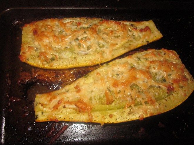 two omelets sitting on top of a pan covered in cheese