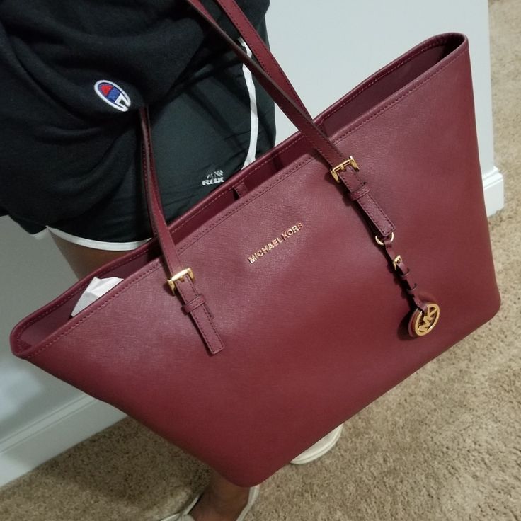 Maroon Mk Jet Set Bag With Gold Lettering. The Handbag Is New But There Are No Tags Attached. Michael Kors Large Capacity Shoulder Bag For Errands, Classic Michael Kors Bag With Removable Pouch, Michael Kors Classic Bag With Removable Pouch, Michael Kors Travel Bags With Large Capacity, Michael Kors Shoulder Bag With Gold-tone Hardware For Travel, Michael Kors Large Capacity Travel Bag, Michael Kors Tote Bag For Daily Use, Luxury Michael Kors Shoulder Bag With Large Capacity, Classic Michael Kors Bag For Daily Use