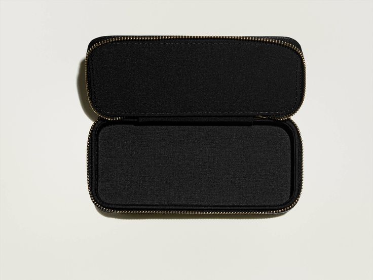 Handcrafted from vegan leather with a seamless zip closure, The MOSCOT ZIP CASE is designed to house your favorite frame in a stylish manner. When it’s not on your face, keep it in a case! *Because of its dimensions, this case fits most, but not all, frames. *Please note, a shipping fee will apply to orders less than $95. Compact Travel Cases With Zipper Closure, Rectangular Travel Cases With Zipper Closure, Rectangular Travel Case With Zipper Closure, Versatile Rectangular Case With Zipper Closure, Modern Rectangular Cases With Zipper Pouch, Black Pencil Case With Zipper Closure As Gift, Functional Cases With Zipper Closure For Personal Use, Versatile Cases With Zipper Closure For Daily Use, Versatile Daily Use Cases With Zipper Closure