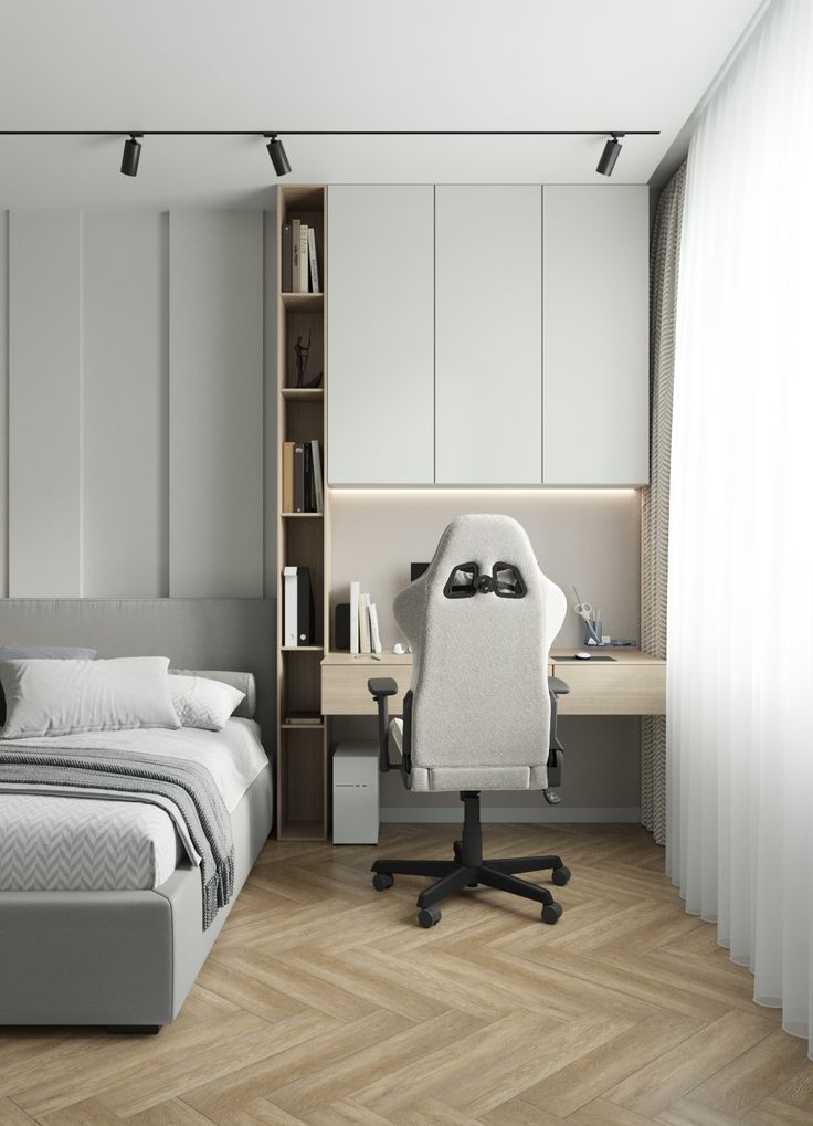 a bedroom with a bed, desk and chair in the corner next to a book shelf