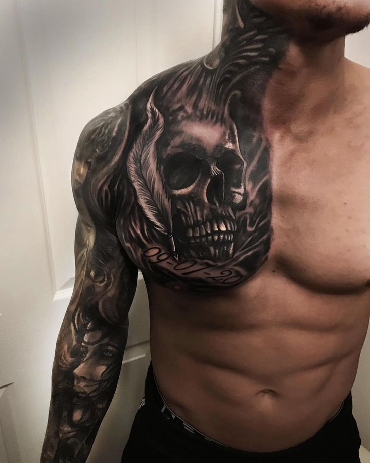 a man with a skull tattoo on his chest