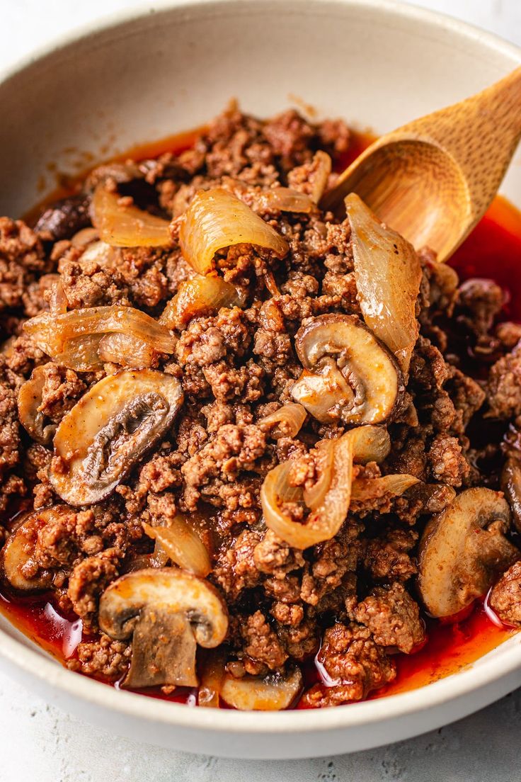 an easy ground beef dish with mushrooms in a white bowl