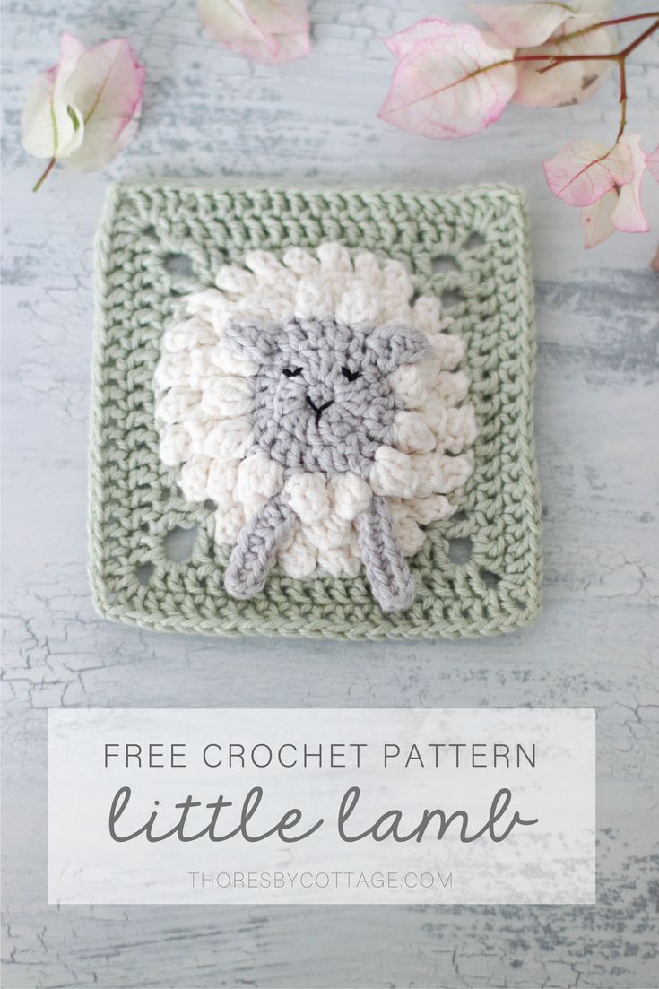 a crocheted square with a sheep on it