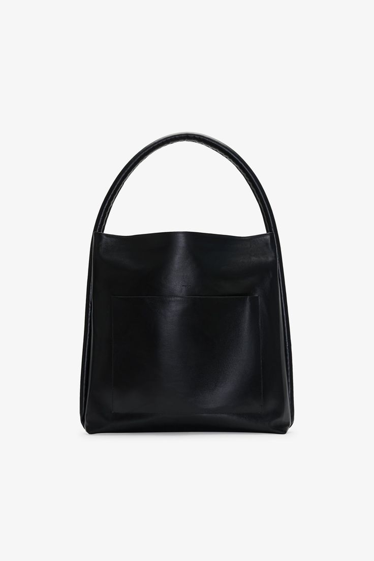 Bold and brilliantly functional—that's our Ingens Oversized Tote. Crafted from glossy European spazzolato leather, this square-shaped design features tubular handles and handbag feet to keep her in prime condition. With a generously sized, pocketed interior, an oversized front pocket, and zipper closures throughout, Ingens is set to tote all your essentials in style. | Available in one size. Total length is approximately 20.5" (52 cm). Height is approximately 21" (53 cm). Depth is approximately Modern Rectangular Hobo Bag With Handle Drop, Rectangular Hobo Bag For Work, Modern Square Hobo Bag With Leather Handles, Modern Hobo Bag With Round Handle For Shopping, Modern Square Bucket Bag For Business, Modern Rectangular Hobo Bag With Detachable Handle, Modern Rectangular Hobo Bag For Work, Modern Rectangular Hobo Bag For Shopping, Modern Square Hobo Bag With Top Carry Handle