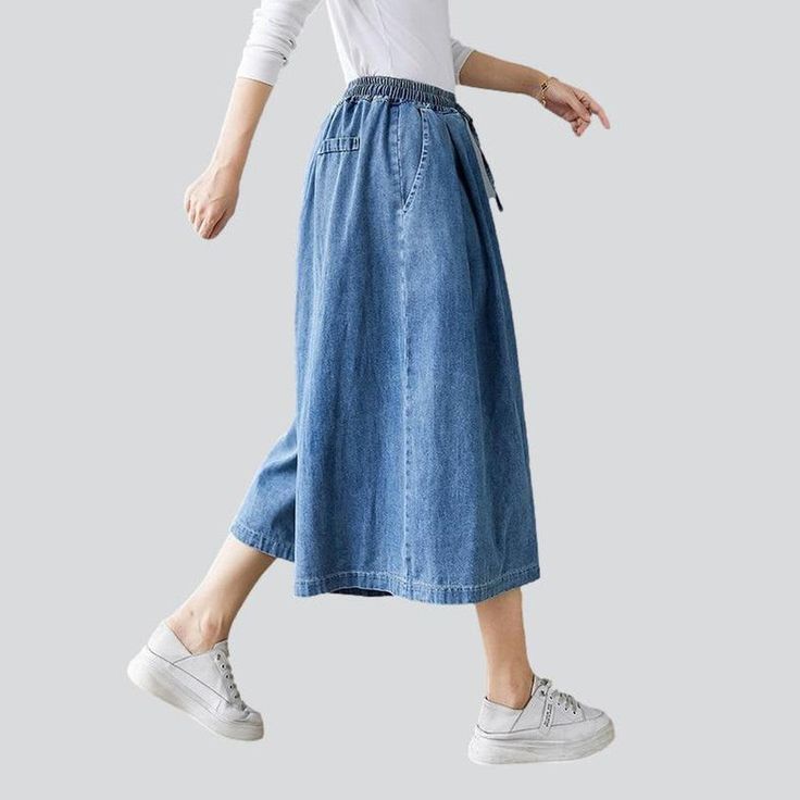 Take your laid-back trend to a whole new level with our 2023 Spring-Summer Collection of short culottes denim pants! These high-waisted. medium wash pants feature drawstrings closure for a unique and stylish look. Enjoy the perfect balance of comfort and trendy with these amazing culottes!Distinctive Features: Street vibe for a one-of-a-kind look Medium wash for a conventional chic look High-rise for a flattering fit Drawstring closure for added style and convenience Style and Comfort CombinedOu Casual Summer Jeans With Elastic Waistband, Spring Blue Jeans With Drawstring, Blue Drawstring Jeans For Spring, Spring Mid-rise Jeans With Drawstring, Mid-rise Jeans With Drawstring For Spring, Denim Blue Jeans With Drawstring For Spring, Trendy Summer Jeans With Drawstring, Knee-length Cotton Jeans For Summer, Summer Washed Blue Jeans With Elastic Waistband