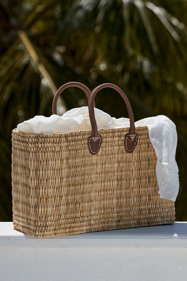 Carry it all, and be cute Imbued with the utter gorgeousness of Lake Como, Monday's structured beach bag is hand-woven of seagrass, with hand-stitched leather handles. It can be used for anything and everything: the beach, the city, the rolling hills around the lakes of Italy. It is as versatile as it is beautiful. Features:Structured straw bag Hand-woven seagrass constructionArtisan leather handlesHeight: 12.2"Base: 17..71" x 7.08"This bag is made from natural materials and there can be slight Leather Beach Bag, Coastal Autumn, Beautiful Features, Large Beach Bags, Chevron Fabric, Rolling Hills, Stitching Leather, Lake Como, Overnight Bag