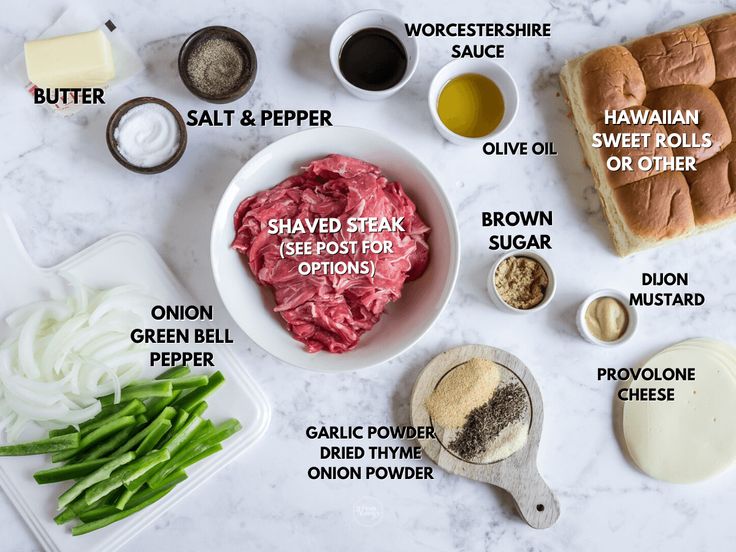 ingredients to make a sandwich laid out on a white marble counter top, including green beans, mayonnaise, salt and pepper