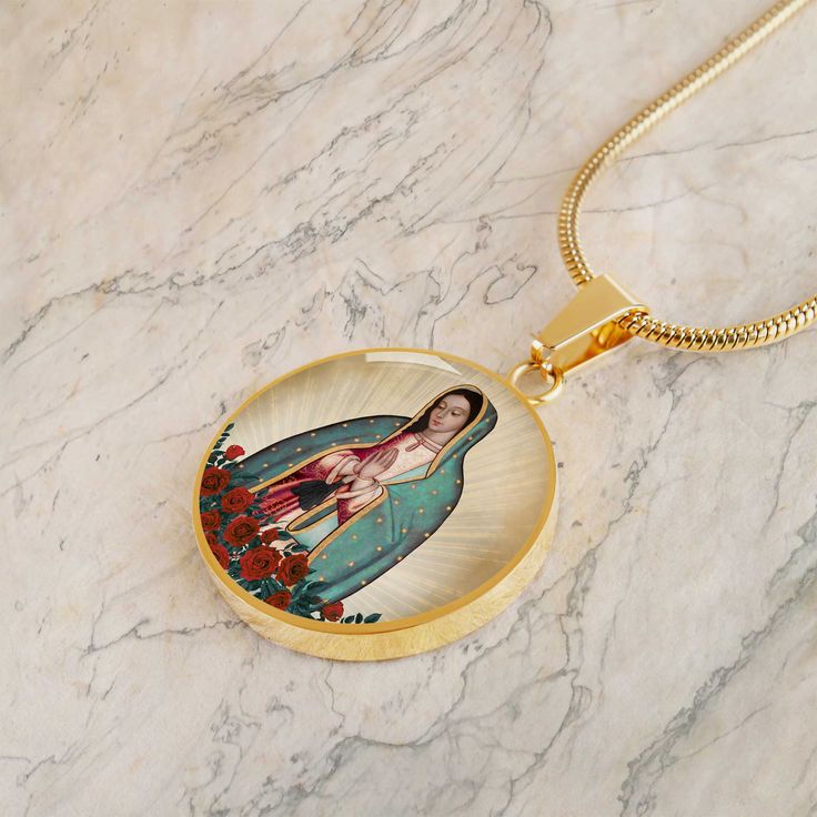 The Our Lady of Guadalupe Pendant Necklace is handcrafted from Surgical Steel or 18k Gold finish with a hand-poured liquid glass dome. The durable charm measures 0.9" diameter (about the size of a quarter) and comes with an adjustable 18"- 22" luxury chain. A truly beautiful accessory that makes a lovely and unique gift. ■ Silver: Surgical Steel■ Gold: 18k Gold Finish■ Handmade in the USA This is a couture item which is custom made-on-demand. Our couture collections feature exclusive, custom des Our Lady Of Guadalupe, Lady Of Guadalupe, Glass Dome, Glass Domes, Gold Pendant Necklace, Couture Collection, Our Lady, Hand Poured, Gold Finish