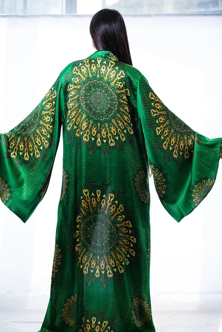 Enjoy+300 silk cover-ups and kimono robes with vibrant prints; Custom-made just for you. Screams Luxury and feel comfy wherever you go! ➡️ Shop Now! Luxury Purple Silk Kimono, Green Silk Floor-length Kaftan, Elegant Green Kaftan For Festivals, Elegant Green Festival Kaftan, Green Silk Kaftan With Kimono Sleeves, Elegant Long Green Kimono, Green Traditional Kaftan With Kimono Sleeves, Traditional Green Kaftan With Kimono Sleeves, Bohemian Green Long Abaya