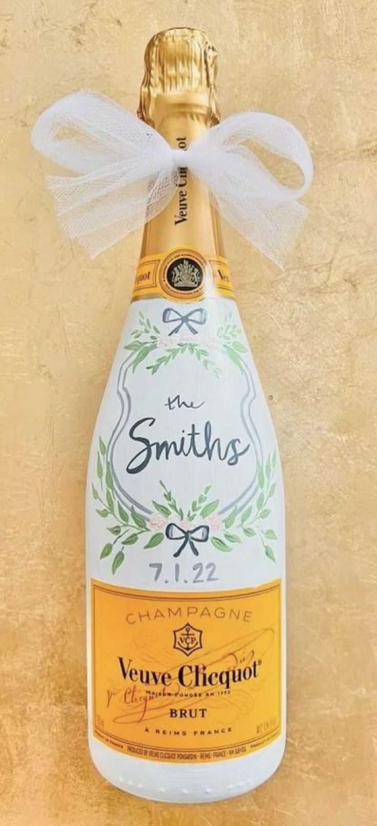 a bottle of champagne with a bow on the top and label that says, smiths champagne