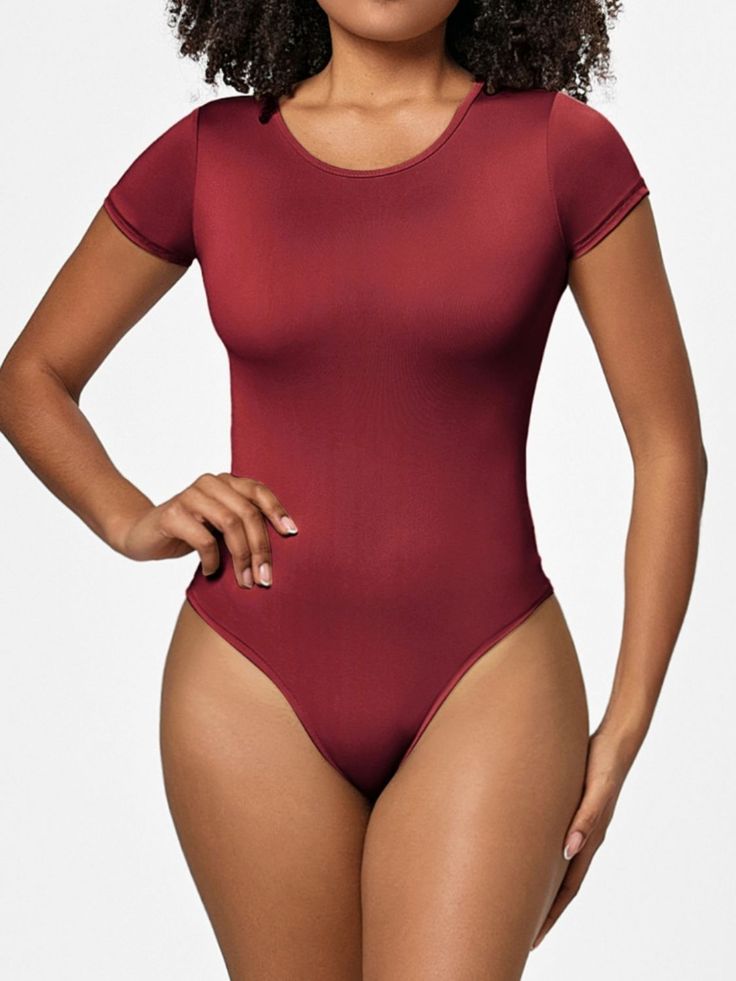 Features: Basic style Sheer: Opaque Stretch: Slightly stretchy Material composition: 79.3% polyester, 20.7% spandex Care instructions: Machine wash cold. Tumble dry low. Imported Size US Top Length Bust Waist Hip Shoulder Sleeve Length S 2/4 26.2 26.8 22 25.2 12.6 4.9 M 6 26.8 28.3 23.6 26.8 13.4 5.3 L 8 27.4 29.9 25.2 28.3 14.2 5.7 XL 10 28 31.5 26.8 29.9 15 6.1 2XL 12 28.5 33.1 28.3 31.5 15.7 6.5 3XL 14 29.1 34.6 29.9 33.1 16.5 6.9 Women's Business Casual, Casual Professional, Bodysuit Black, Casual Styles, Short Sleeve Bodysuit, Spring Tops, Spring Looks, Denim Overalls, Short Rompers