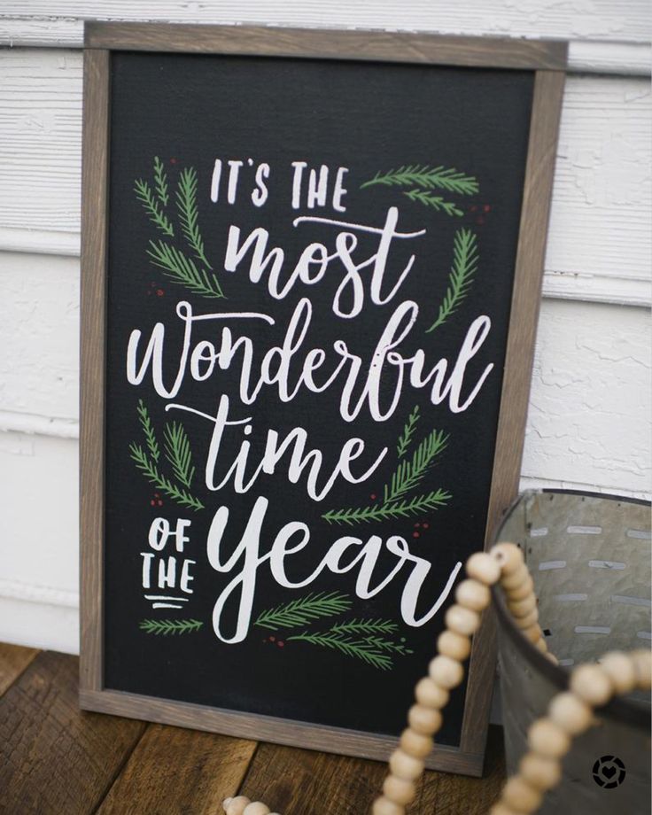 a chalkboard sign that says it's the most wonderful time of the year