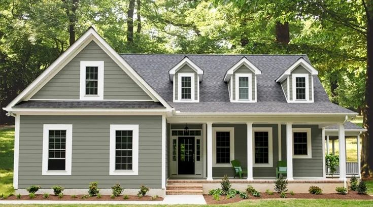 a gray house with white trim and windows