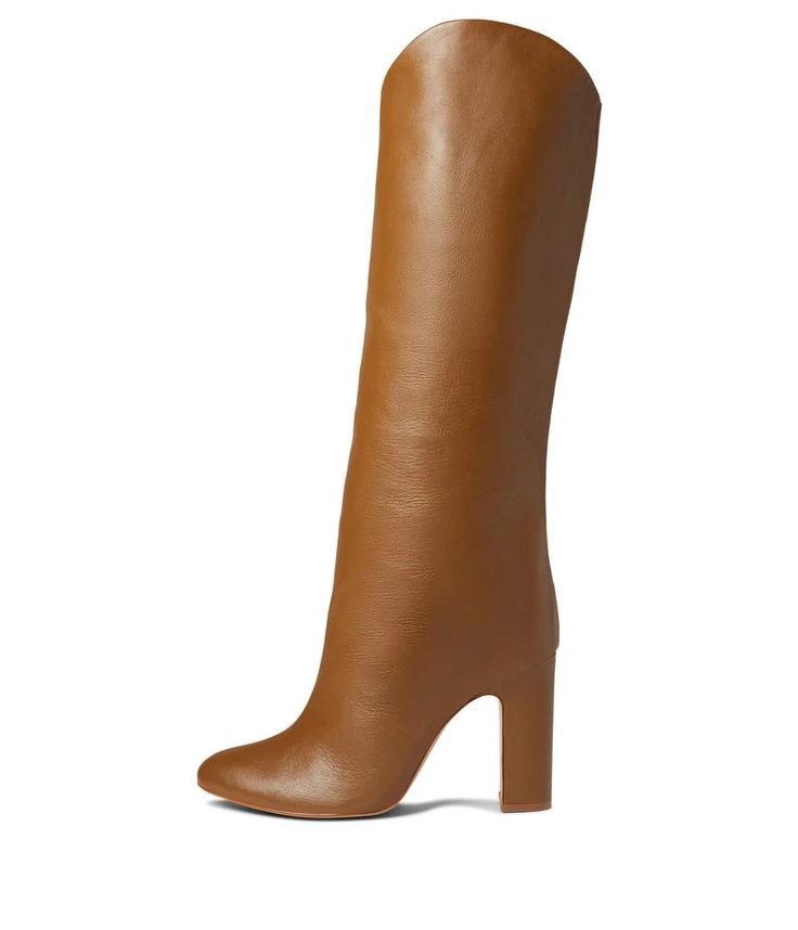 Look absolutely chic and stay comfortable wearing the Schutz® Gabrielle Up Boots..Leather upper..Leather lining and insole..Pull-on style closure..Pointed toe silhouette..Stylish block heel style..Leather outsole..Made in Brazil..Product measurements were taken using size 8.5, width M. Please note that measurements may vary by size..Weight of footwear is based on a single item, not a pair..Measurements: Heel Height: 3 3/4 in Weight: 14 oz Circumference: 14 in Shaft: 18 in Calf Leather Boots With Stacked Heel And Closed Toe, Calf Leather Boots With Stacked Heel, Brown Heeled Boots With Sculpted Heel And Medium Width, Square Toe Heels With Leather Lining For Fall, Brown Heeled Boots With Sculpted Heel, Fall Square Toe Heels With Leather Lining, Brown Medium Width Heeled Boots With Sculpted Heel, Faux Leather Boots With Sculpted Heel And Almond Toe, Fall Heels With Leather Lining And Round Toe