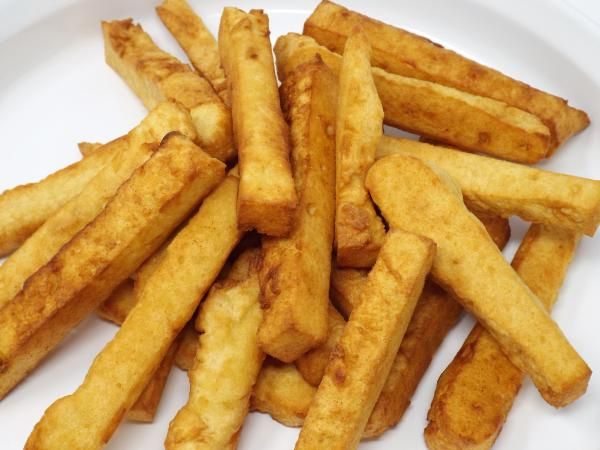 french fries on a white plate ready to be eaten