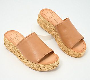 This fashionable flatform sandal pairs sleek leather with boho-chic raffia, creating a cool juxtaposition that's just as at home at the beach resort as it is in the city center. From Dolce Vita. Chic Slip-on Wedge Sandals With Woven Sole, Summer Beige Leather Wedge Sandals, Leather Wedge Sandals With Woven Sole For Vacation, Trendy Woven Leather Beach Sandals, Brown Woven Sole Sandals For Summer, Beige Leather Wedge Sandals For Beach, Comfortable Platform Wedge Sandals For Summer, Beige Leather Wedge Sandals For Vacation, Chic Platform Espadrilles With Open Toe