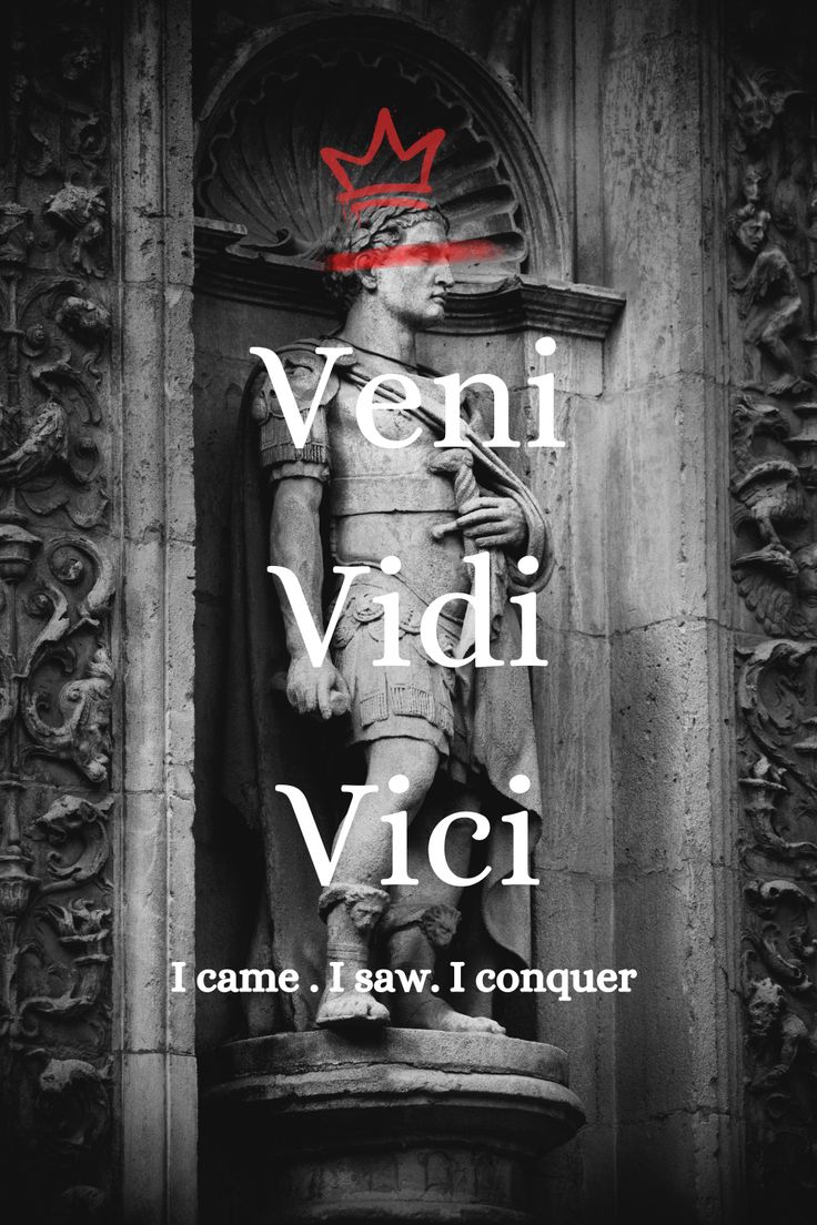 a statue with the words veni vidi vici in red and white on it