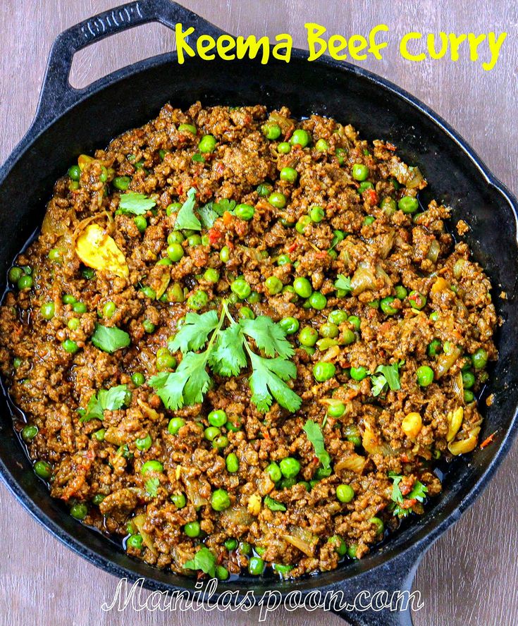 a skillet filled with meat and peas