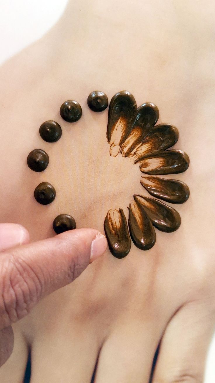 a woman's stomach with coffee beans arranged in the shape of a circle