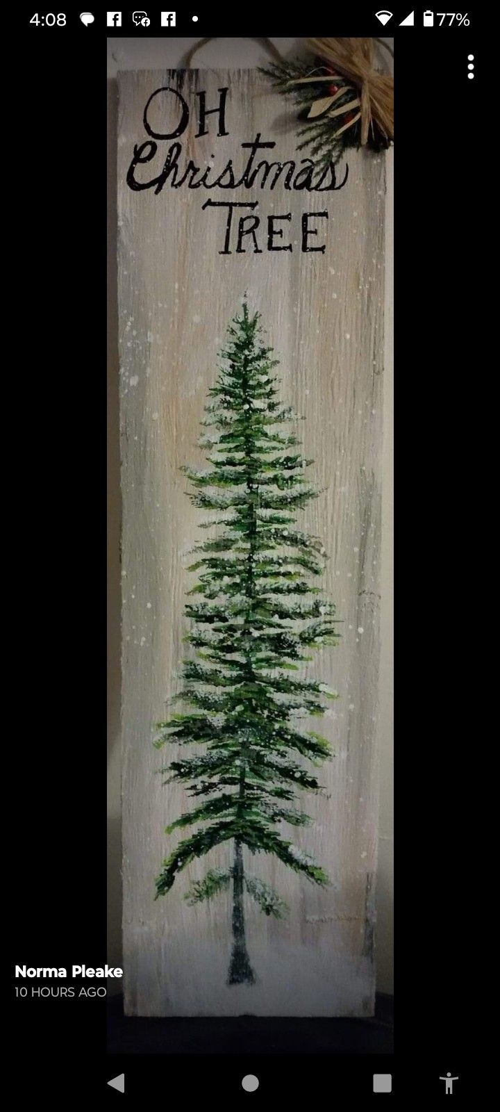 a christmas tree painted on a wooden board