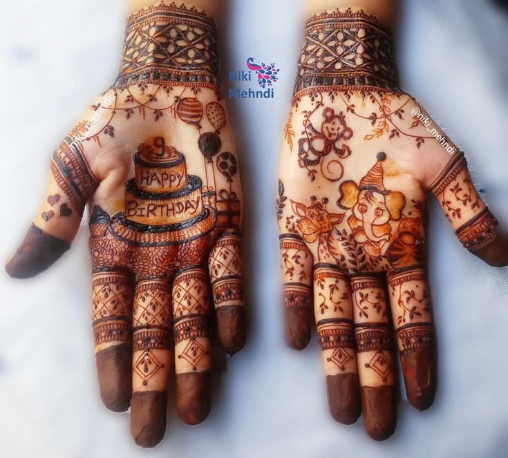 two hands with hendi designs on them