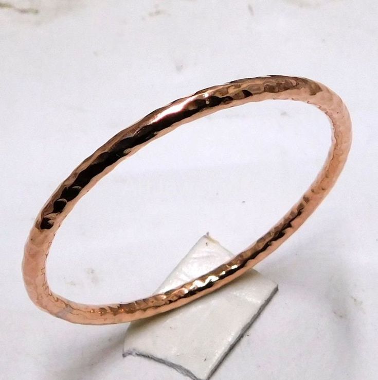 Hammered Solid Pure Copper Bangle, copper Bracelet, Solid Copper bangle, Healing Arthritis Copper Bangle, Bridesmaids Gift Handmade item Materials: Copper Adjustable : No Style: Minimalist Bracelet Size Inches Circumference/Diameter 7 / 2.23 7.5 / 2.39 8 / 2.55 8.5 / 2.71 9 / 2.87 9.5 / 3 Elegant, , minimal and shiny ! A lovely basic to have in your wardrobe and wear anytime  O T H E R ∙ I N F O R M A T I O N * All items are nicely packaged ready to gift in elegant jewelry boxes. Please store your jewelry away from humidity, the best place being in a jewelry box  IMPORANT NOTE ON BANGLE SIZES  Please see the photo in the listing that shows how to measure for your bangle size. Your bangle size is determined more by the size of your hand than your wrist. To find out your bangle size, simply Handmade Copper Bangle Bracelets, Hand Forged Copper Bangle Bracelet, Gold Electroformed Bracelets For Gift, Hammered Copper Bangle Bracelets, Hammered Copper Bangle Bracelet, Adjustable Hammered Rose Gold Bangle, Hammered Rose Gold Bangle, Electroformed Copper Bangle, Rose Gold Copper Bangle Cuff Bracelet