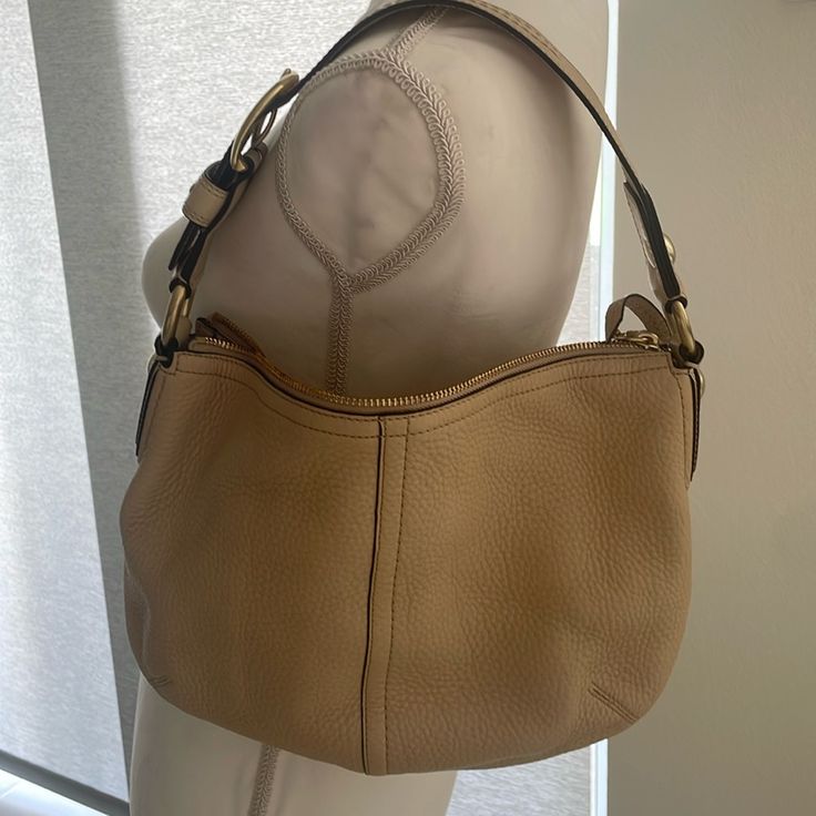 Coach - Beige Leather Handbag. Brand New No Tags. Has 2 Very Small Blemishes Due To Storage. Comes With Dust Bag. Never Used. Classic Beige Hobo Bag With Gold-tone Hardware, Coach Beige Shoulder Bag With Zipper Closure, Beige Coach Shoulder Bag With Zipper Closure, Elegant Cream Hobo Bag With Zipper Closure, Everyday Cream Hobo Bag With Gold-tone Hardware, Cream Hobo Bag With Gold-tone Hardware, Cream Hobo Bag With Gold-tone Hardware For Everyday, Coach Beige Soft Leather Satchel, Coach Soft Leather Beige Satchel